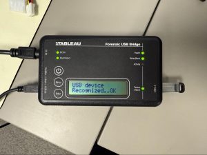 The top of a USB Bridge with the status message "USB device Recognized...OK".